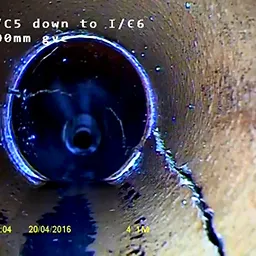 the inside of a pipe connected to a drain